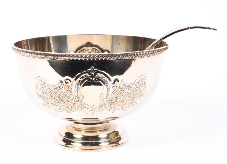 A silver plated punch bowl and ladle