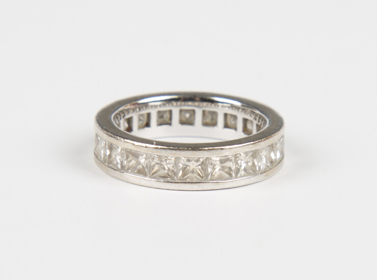 A white gold and diamond full eternity ring, mounted with princess cut diamonds, weight 6g, ring siz