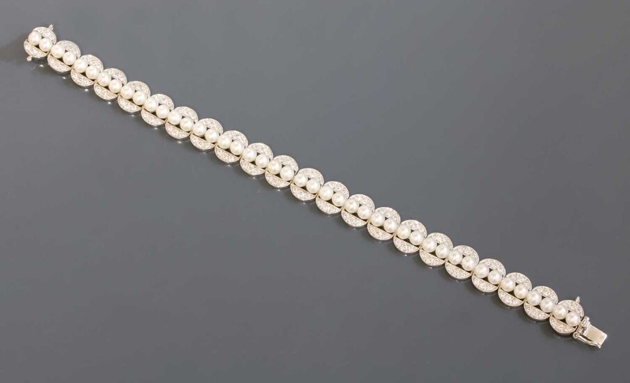 A white gold cultured pearl and diamond bracelet