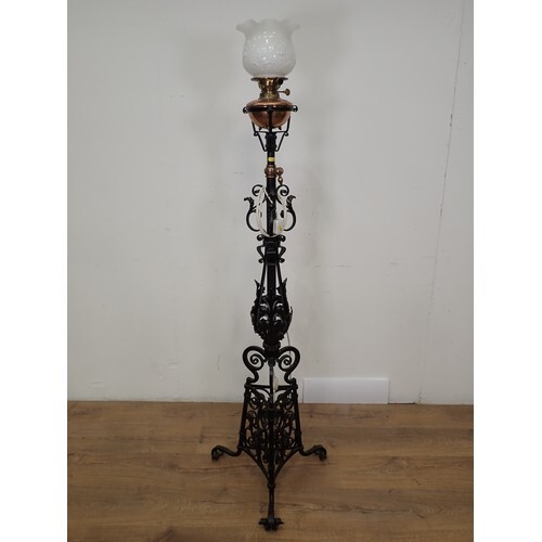 A wrought iron Lamp Standard with opaque shade and copper re...