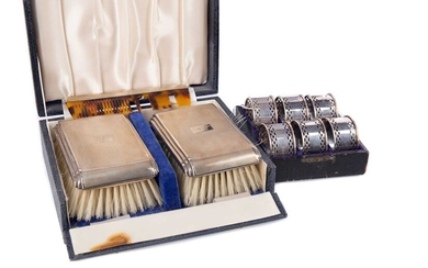 AN ELIZABETH II SILVER BACKED BRUSH SET, ALONG WITH A SET OF NAPKIN RINGS AND TEASPOONS