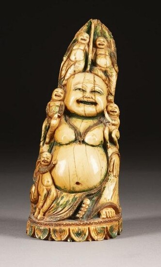 AN IVORY CARVED STATUE OF MAITREYA WITH FIVE KIDS