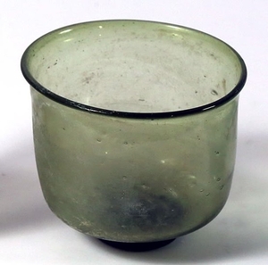 AN OLIVE GREEN GLASS CUP