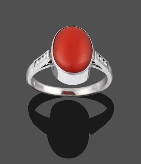 An 18 Carat White Gold Coral and Diamond Ring, the...