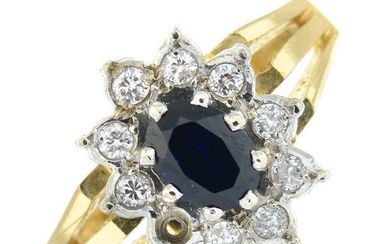 An 18ct gold sapphire and brilliant-cut diamond cluster ring. AF.