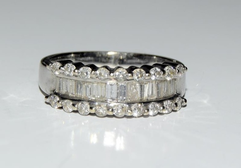 An 18ct white gold ladies baguette cut diamond ring, Approx....