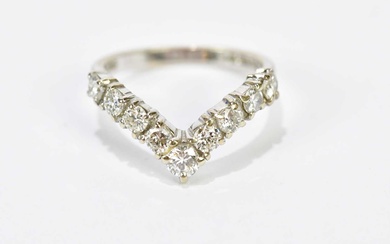 An 18ct white gold nine stone diamond wishbone ring, each...
