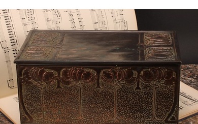 An Arts and Crafts copper rectangular caddy, decorated in re...