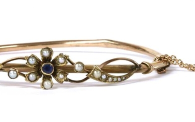 An Edwardian gold sapphire and split pearl bangle
