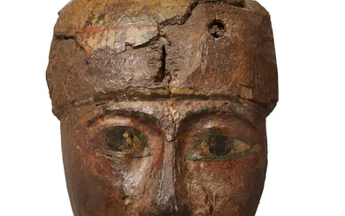 An Egyptian polychrome painted wood coffin mask, Third Intermediate Period, circa 1069-715...