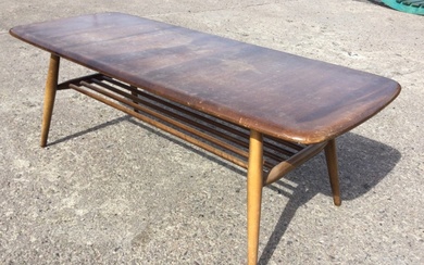 An Ercol elm & beech coffee table with rounded rectangular...