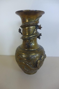 An Oriental bronze dragon vase, with character marks to base...