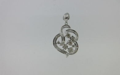 An asymmetric diamond pendant set in 9ct white gold
