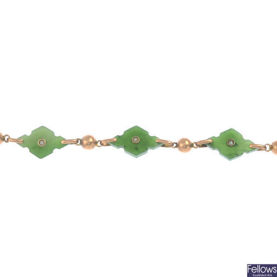 An early 20th century gold nephrite jade and split pearl bracelet.
