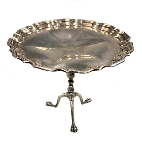 An early 20th century silver miniature tripod wine table