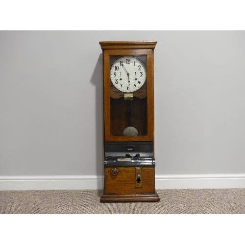 An early 20thC oak cased Clocking-In Machine, c.1930's, of t...