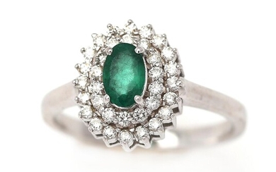 NOT SOLD. An emerald ring set with an emerald encircled by numerous diamonds, monuted in 14k white gold. Size 52. – Bruun Rasmussen Auctioneers of Fine Art