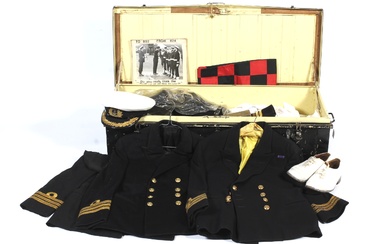 An officer's Naval Air Service metal uniform trunk and contents. Including uniforms, coats, jackets, caps, trousers, footwear, spare badges, buttons, EPNS cigarette case, etc.