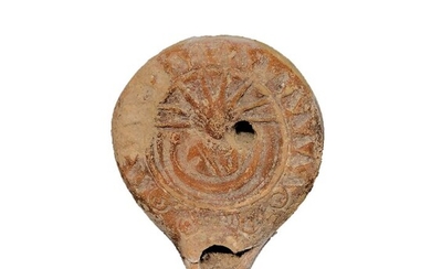 Ancient Roman Terracotta oil lamp decorated with the bust of Helios, 8,2 cm