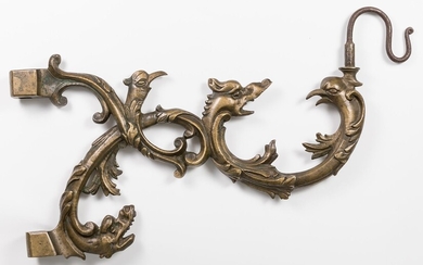 Arm with grotesques for wall lamp; Holland, XVII century. Bronze and iron.