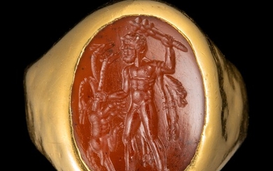 *BAGUE en or, sertie d’une intaille romaine sur cornaline. Hercule combattant l’Hydre de Lerne. La...