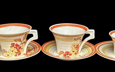 CLARICE CLIFF; a tea for two tea service decorated in...