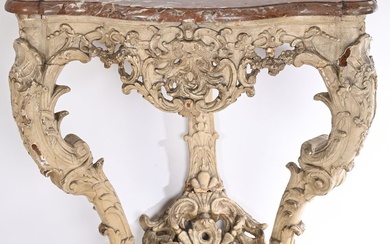 CONSOLE LOUIS XV de forme mouvementée en chêne rechampi à riche décor sculpté de coquilles,...