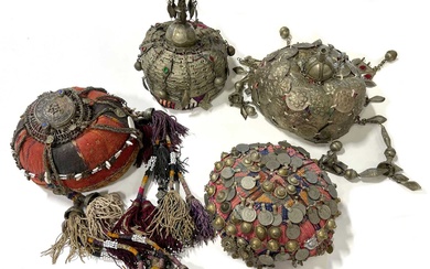 Four Afghan hats, metal adornments