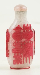 Glass snuff bottle with red and white overlay. China. Late 19th century.