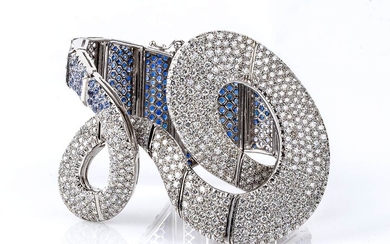Gold ribbon bracelet with diamonds and blue sapphires pavé 18k...