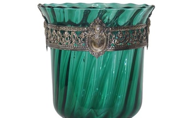 Green glass vase with floral motif railing and cherub faces