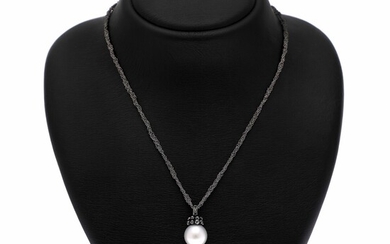 Hartmann's: A necklace of oxidized silver with a pearl and diamond pendant set with a cultured Tahiti pearl and black diamonds, mounted in 18k white gold.