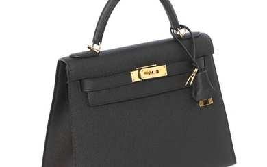 Hermès A “Kelly Sellier 28” bag of black leather with gold tone...