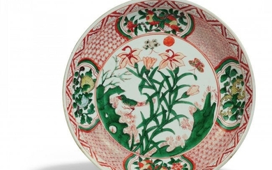Important and rare dish with lilies and singing bird