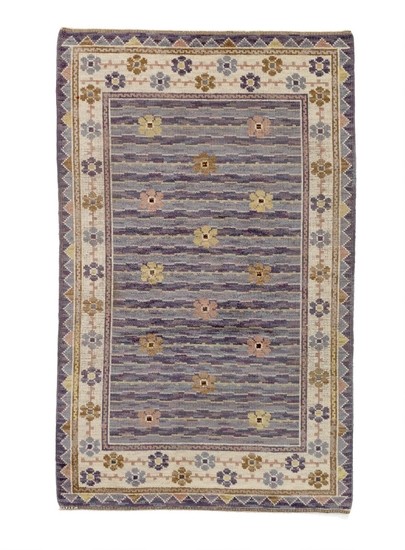 Märta Måås-Fjetterström: “Steninge”. Handwoven “flossa” carpet of wool with polychrome floral pattern. Signed MMF. L. 235 cm. W. 145 cm.