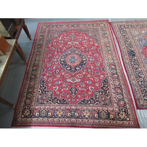 Middle Eastern design Mashad carpet mainly on a red and blue...