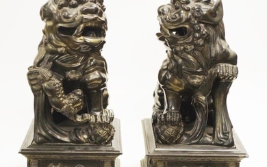 Pair of Chinese large decorative Foo dogs on a...