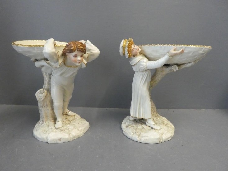 Pair of Worcester figures with a young man and girl supporti...