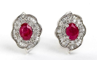 Pair of rubies and diamonds gold earrings