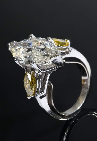 Platinum ring with navette cut diamond (ca.4.58ct/P2/TCA/M) and 2 side yellow navette cut diamonds (together ca. 1.11ct/SI1/Fancy Vivid Yellow), total weight 6,4g, size 50 (reduction clasp), GIA report from October 2023 is available