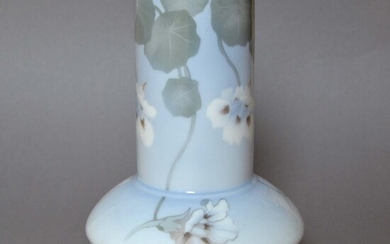 SOLD. Royal Copenhagen: A porcelain vase decorated with flowers and foliage. H. 21.5 cm. – Bruun Rasmussen Auctioneers of Fine Art