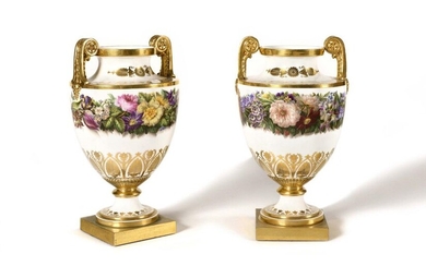 Sèvres Pair of royal vases called Clodion vases of the third size in Sèvres porcelain of the Charles X period, dated 1827-28, with polychrome decoration of large garlands of flowers, gold decoration of a frieze of palmettes, foliage and foliage...