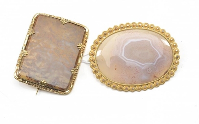TWO LARGE AGATE SPECIMEN SET IN BROOCHES, THE RECTANGULAR MEASURING 55X45MM, AND THE OVAL 65X50MM