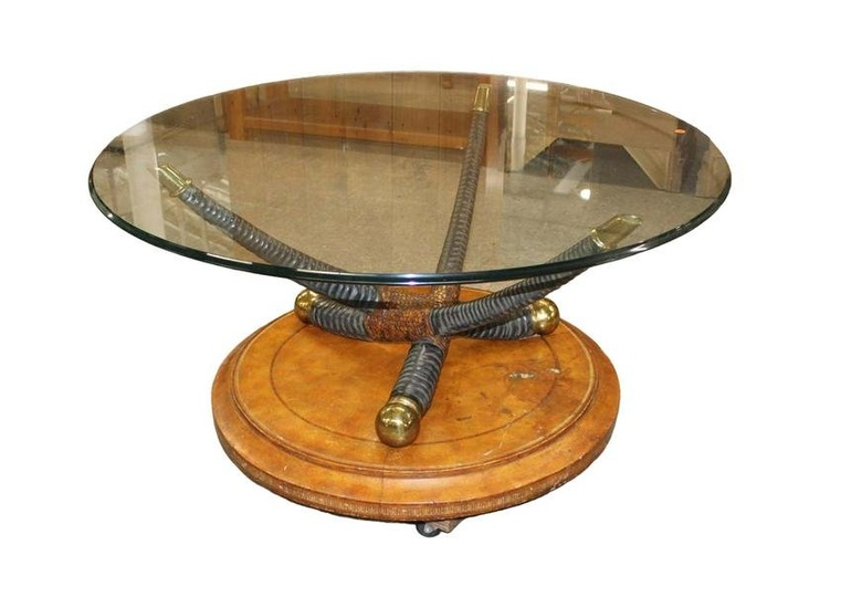 Tagged Maitland Smith 44" diameter glass top leather base with horn style decoration cocktail table