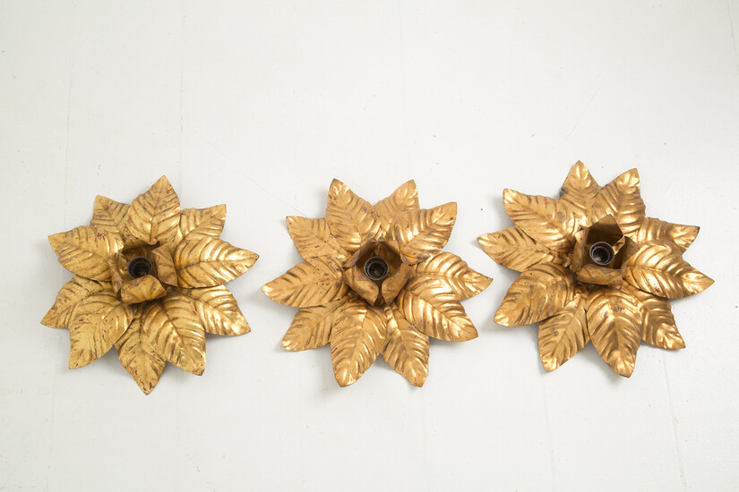 Three bronze sconces in the shape of leaves