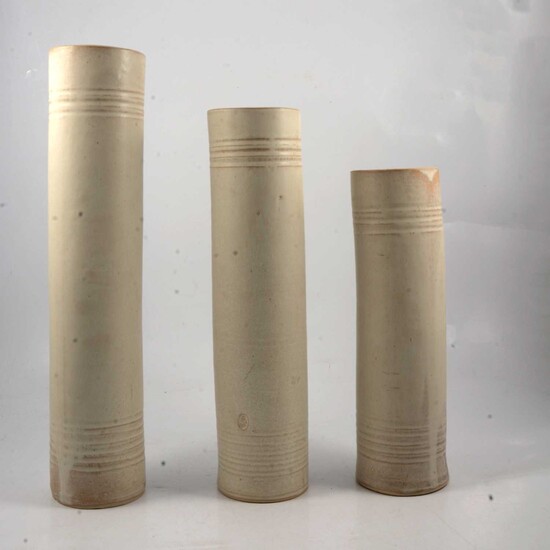 Three studio pottery cylindrical vases.