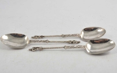 Three white metal Apostle spoons.
