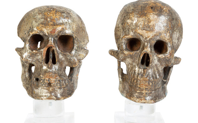 Two Italian Silvered Wood Memento Mori Skulls