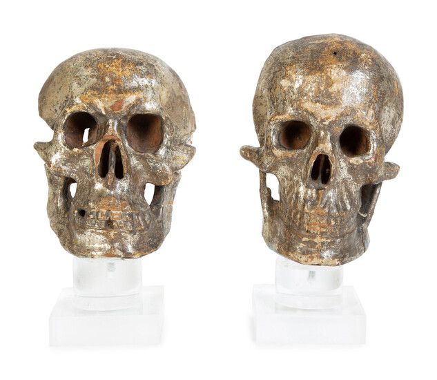 Two Italian Silvered Wood Memento Mori Skulls
