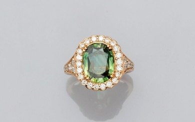 Two gold ring, 750 MM, set with a beautiful oval cut green sapphire weighing 4.07 carats surrounded and shouldered by brilliants, total 1 carat approximately, GGT laboratory certificate, size: 54, weight: 8.95gr. gross.